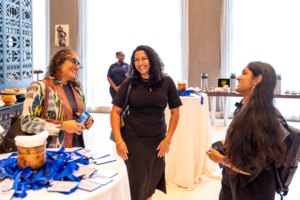 Global 50/50 Justice Sector lead, Govindi Deerasinghe and Finance Sector Lead, Aishwarya Rajeev, speaking to another convening participant